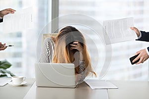 Young woman feeling desperate at work, tired of work.