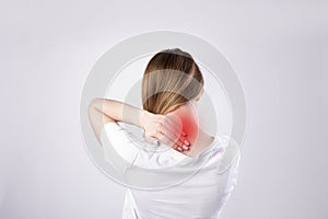 Young woman feeling exhausted and suffering from neck pain, Health concept.
