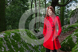 Young woman feeling sad and depressed walking on a forest