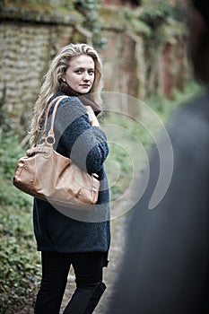 Young Woman Feeling Threatened As She Walks Home photo