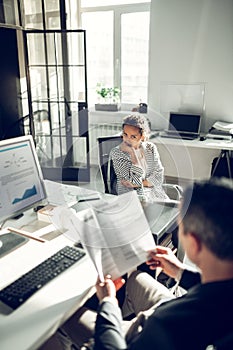 Young woman feeling uncomfortable during job interview