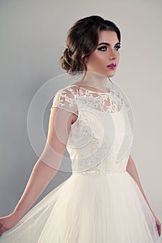 Young Woman Fiancee wearing White Wedding Dress