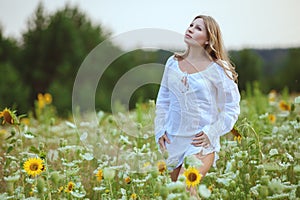 Young woman in field flowers.