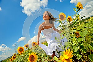 Young woman on field in summer