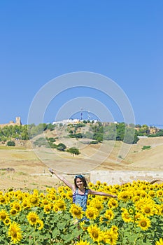 Young woman in a field of sunflowers