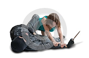 Young woman is fighting with thief on street. Self defense concept.