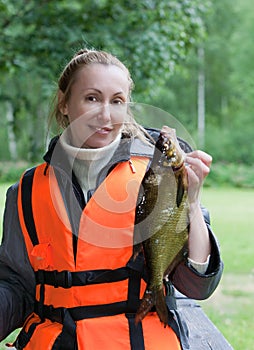 The young woman the fisherman with caught the bream