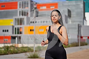 Young woman with fit body running. Female model