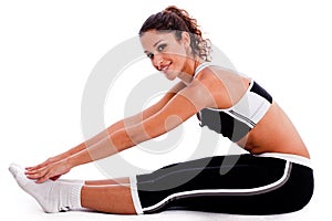 Young woman in fitness outfits stretching photo