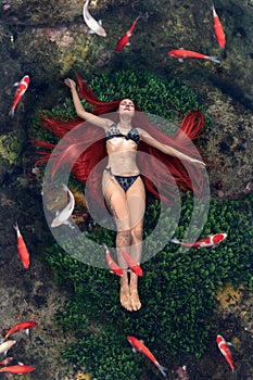 Young woman floating in water