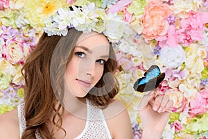 young woman in floral wreath with butterfly photo