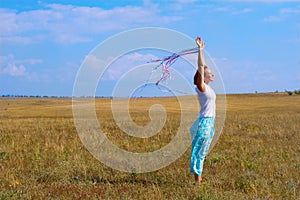 Young woman with flutter ribbons