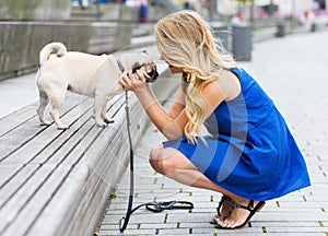 Young woman fondles a pug