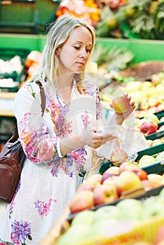 Young woman at food shopping in supermarket