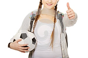 Young woman with foot ball.