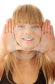 Young woman frame her face