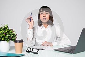 Young woman freelancer female hands with pen writing on notebook in office