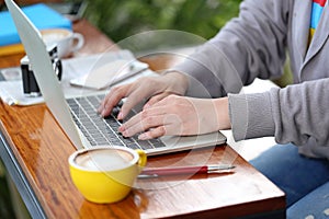 Young woman of freelancer working using laptop computer in coffee shop, Communication technology and Business concept photo