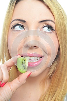 Young woman with fresh kiwi fruit