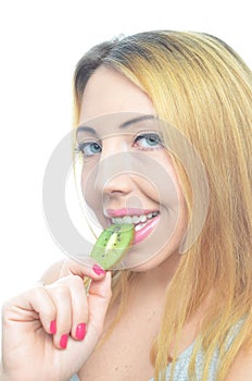 Young woman with fresh kiwi fruit