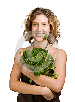 Young woman with fresh parsley