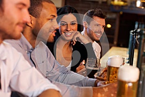 Young woman with friends in pub