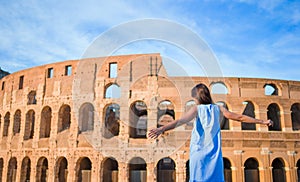 Young woman in front of colosseum in rome, italy