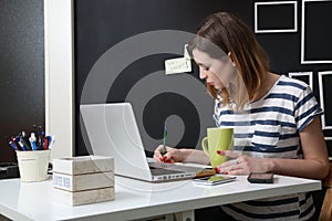 Young woman in front of laptop