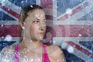 Young woman on frozen background with flag of Great Britan. Concept of crisis in Europe in winter. Energy crisis photo