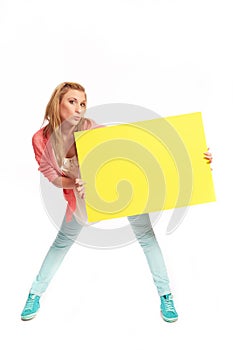 Young woman with funky yellow sign