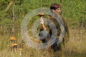 Young woman gathering mushrooms