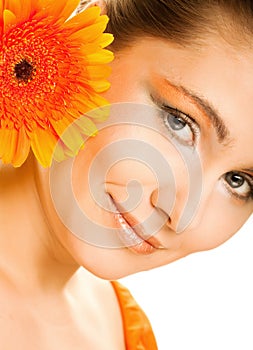 Young woman with gerber flower