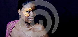 Young woman with a Gerbera Daisy Eye