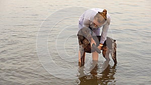 Young woman and German Shorthaired Pointer.