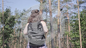 Young woman gets lost in the forest, she calling for the help. The girl is in despair, she is alone in the woods