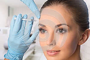 Young woman getting BOTOX injections