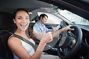 Young woman getting a driving lesson