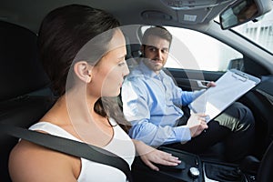 Young woman getting a driving lesson