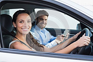 Young woman getting a driving lesson