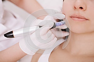 Young woman getting facial skincare treatment photo