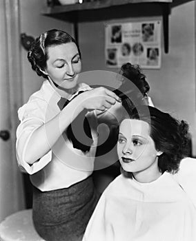 Young woman getting her done in a hair salon photo