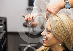 Young woman getting new haircut