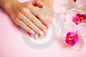 Young woman after getting professional manicure in beauty salon