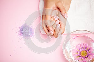 Young woman after getting professional manicure in beauty salon