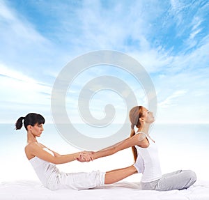 A young woman getting a traditional Thai massage