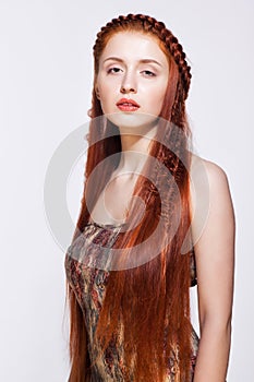 Young woman with ginger braids hairdo on white background