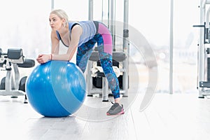 Young woman girl exercise workout in the gym using ball