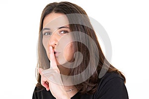 Young woman girl finger on lips in shh secret silence hand face gesture