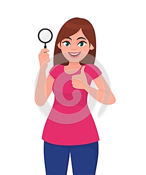 Young woman or girl holding a magnifying glass and making thumbs up gesture sign. Person showing magnifier lens. Female character.