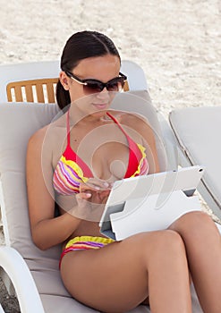 Young woman girl in sunglasses with tablet pc